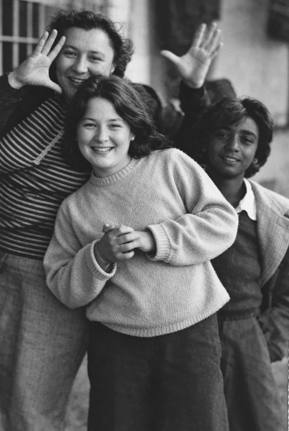 Three students laughing together