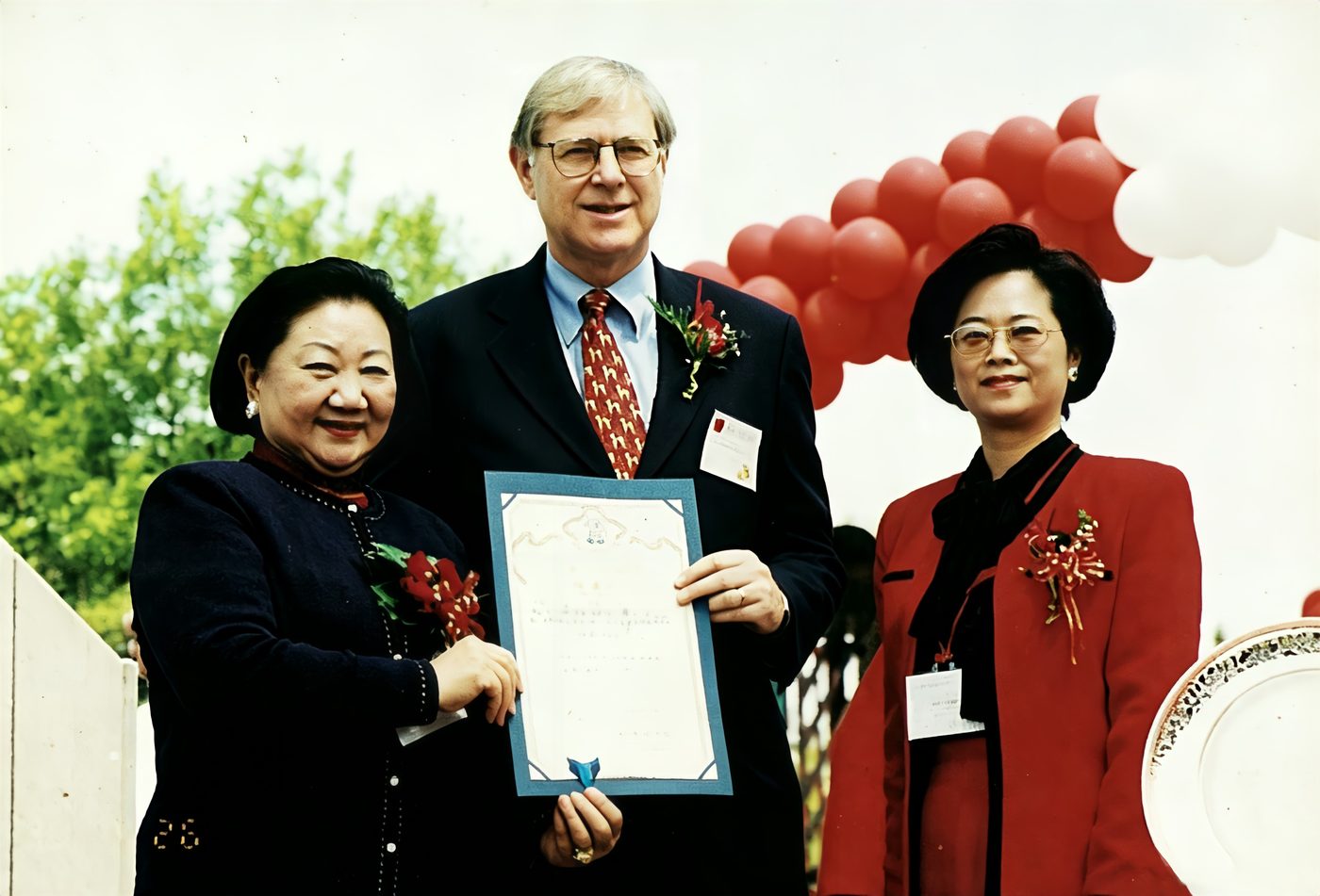 Officials present a framed proclamation at the 40th anniversary
