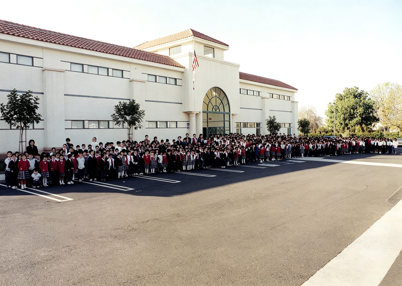 The entire student body assembled outside the new campus building