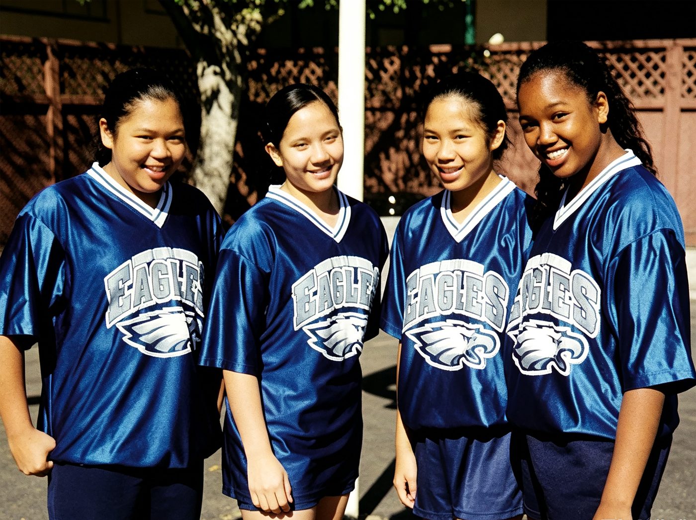 Four South Hills Eagles players in blue jerseys