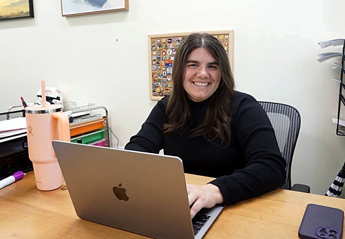 An SHA college counselor at her desk