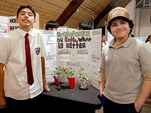 SHA students presenting a science fair research project